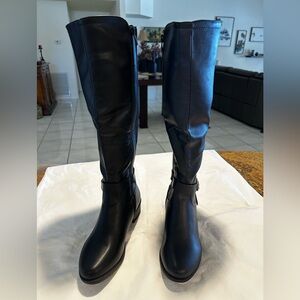 Black knee high black boots…never worn.